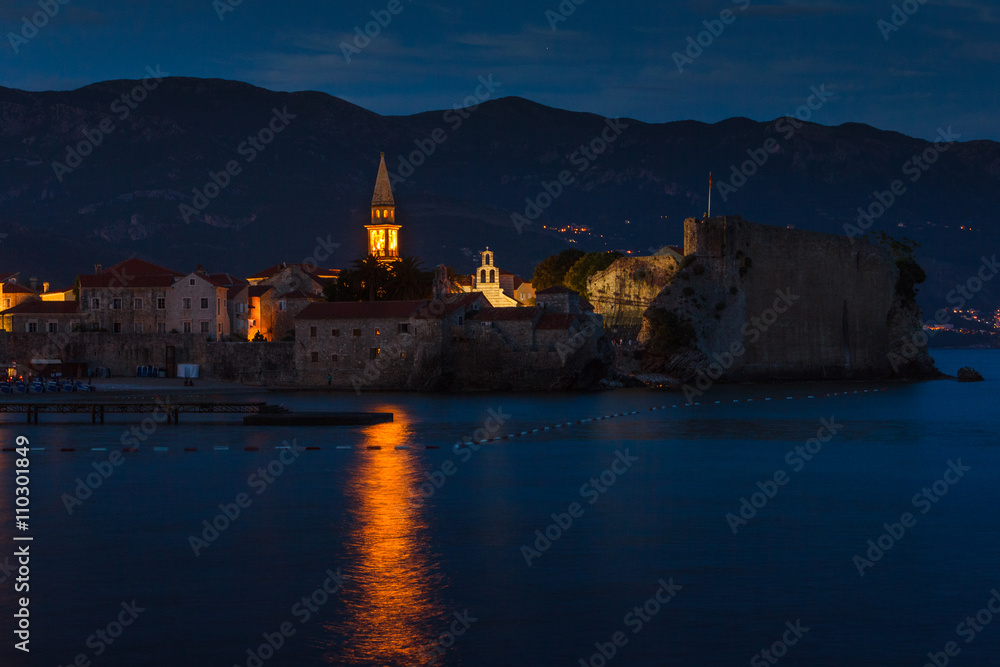 Panoramic view of old town Budva at sunset, blue hours and night.Montenegro.