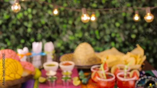 Party table with tamales, strawberry margaritas and pan dulche bread photo