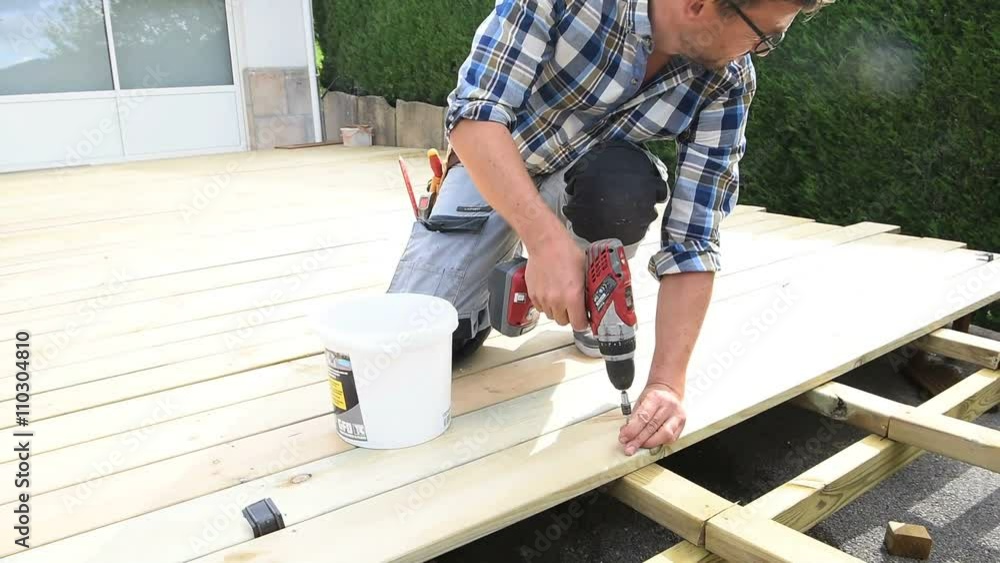Carpenter building wooden deck Carpenter building wooden deck