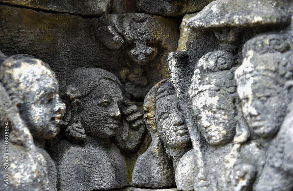 Detail of Buddhist carved relief in Borobudur temple in Yogyakarta, Java, Indonesia.