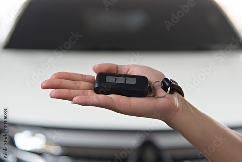 Auto business, car sale, close up of Hand giving key