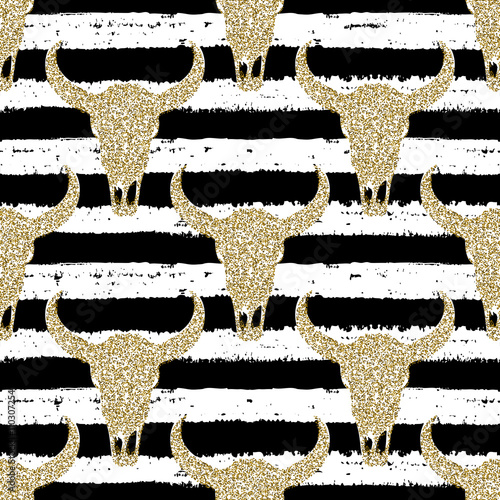 Hand drawn seamless pattern. Gold glitter skulls on striped background. For wrapping, wallpaper, textile, fabric