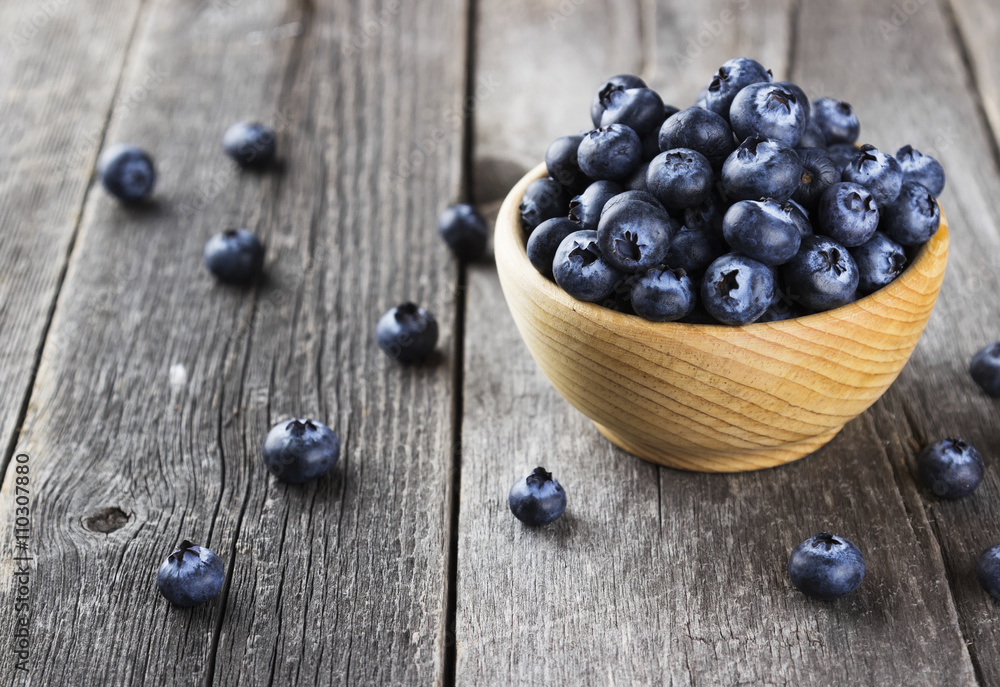 Blueberry on a dark wooden background Blueberry on a dark wooden background