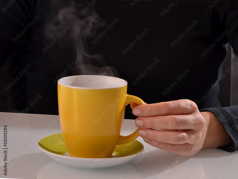 Revolviendo enfriando la taza de cafe,infusion de te caliente. Stock Photo  | Adobe Stock