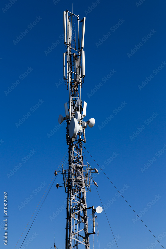 telecommunication towers with antennas on blue sky telecommunication towers with antennas on blue sky