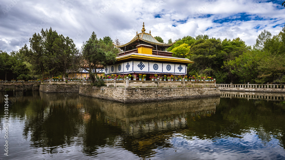 Small temple in the pond of Nobulingka summer Palace, Lhasa, Tibet Small temple in the pond of Nobulingka summer Palace, Lhasa, Tibet