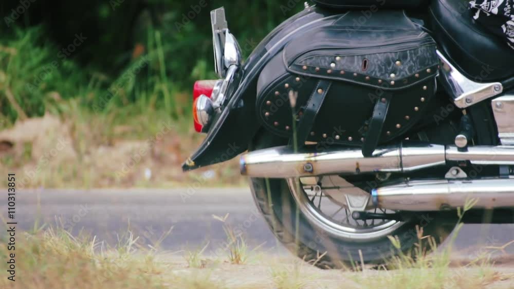 Engine starting on chopper motorbike. Backside view. Engine starting on chopper motorbike. Backside view.