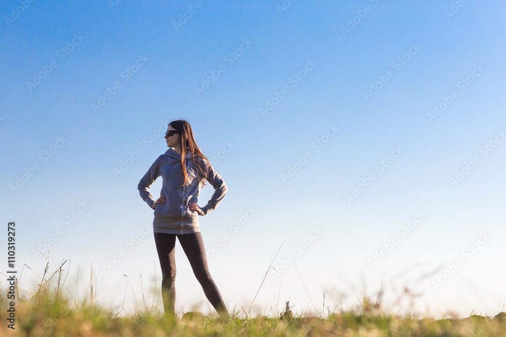  woman standing against the sky.