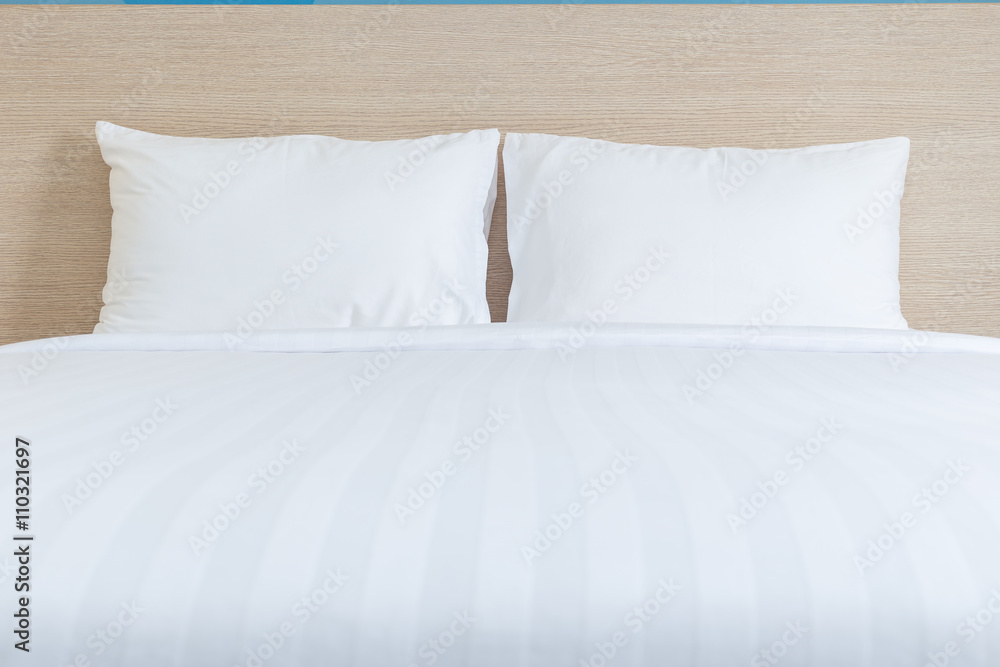 White bedding sheets and pillow in hotel room White bedding sheets and pillow in hotel room