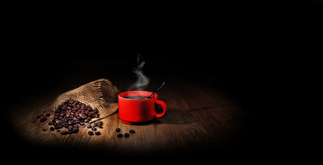 Leinwandbilder Kaffee Bar Rote Tasse mit gerösteten Kaffeebohnen  © guy
