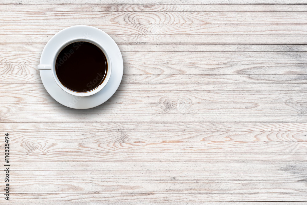 White coffee cup on wooden table top view White coffee cup on wooden table top view