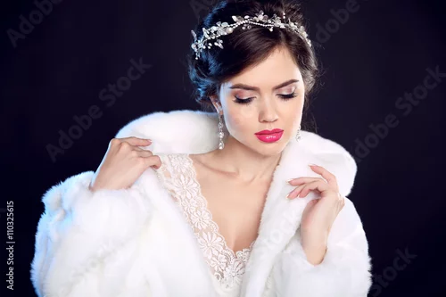 Obraz Fashion portrait of beautiful young woman in white fur coat with
