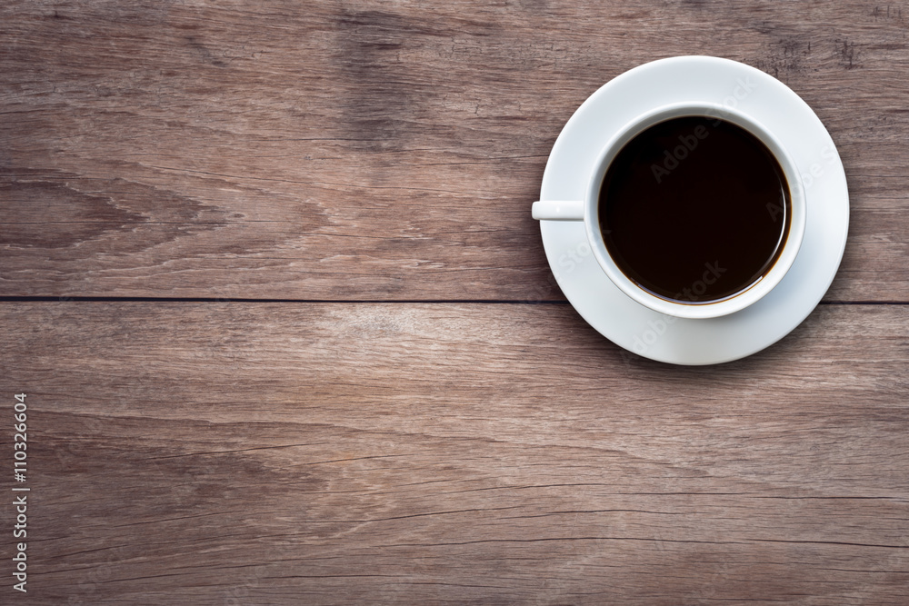 White coffee cup on wooden table top view White coffee cup on wooden table top view