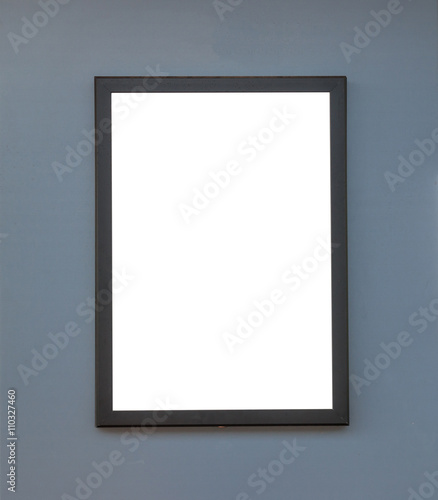 Wooden photo frame on grey wall background