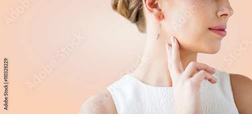 Fotografie close up of beautiful woman face with gold earring