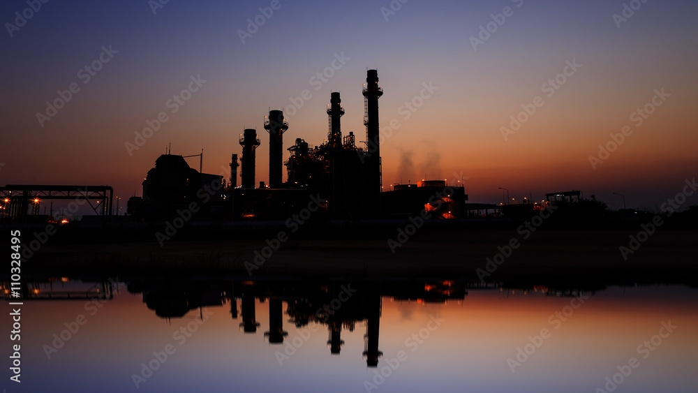 Gas turbine electrical power plant at dusk with light Gas turbine electrical power plant at dusk with light