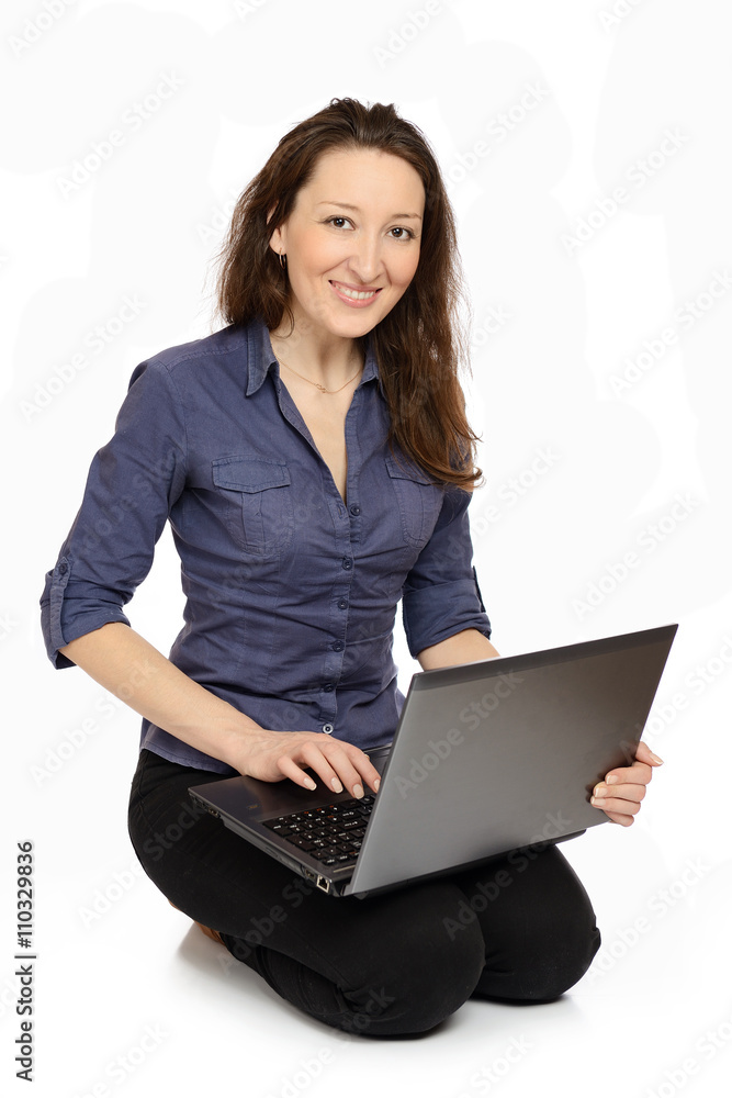 Photo of young woman at work on her laptop Photo of young woman at work on her laptop