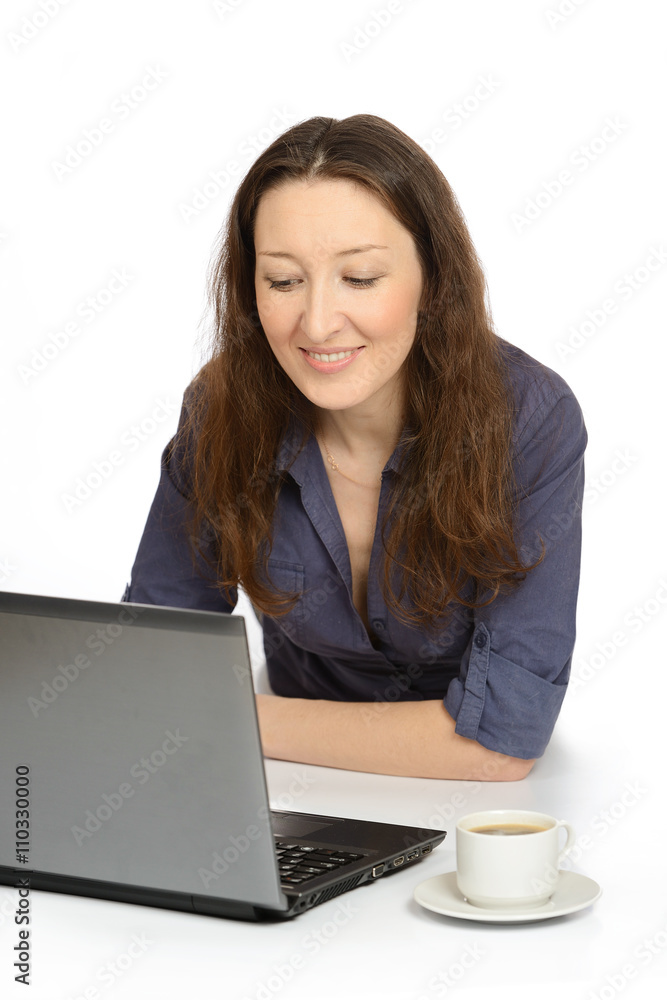 Photo of young woman at work on her laptop Photo of young woman at work on her laptop