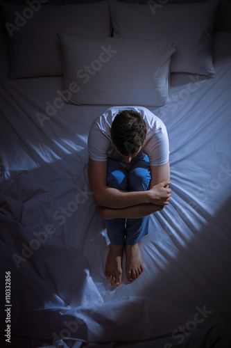 Anxious and scared young man photo