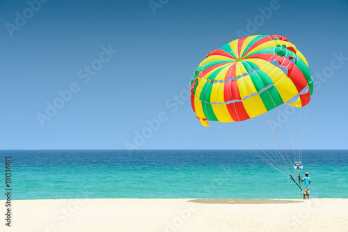 Parachute for tourist on sand beach