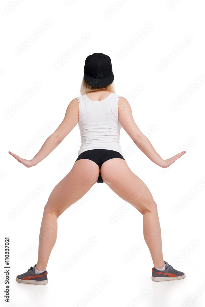 Female model in tank top and briefs showing her back isolated