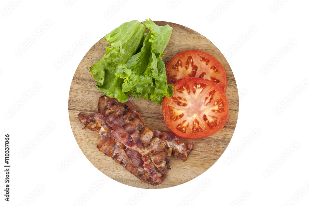 bacon, tomatoes, and lettuce in a wooden plate bacon, tomatoes, and lettuce in a wooden plate