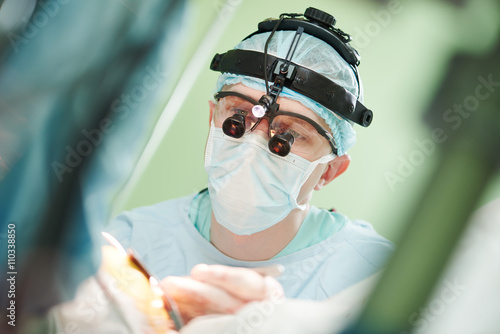 male cardiac surgeon at child cardiosurgery operating room photo