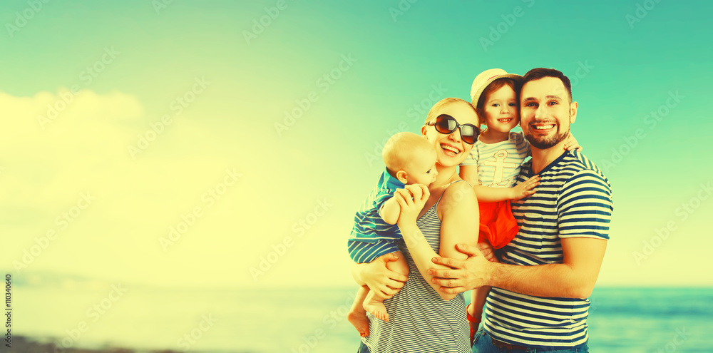happy family of father, mother and two children, baby son and da happy family of father, mother and two children, baby son and da
