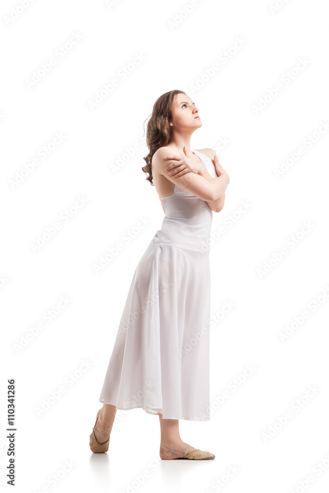 Young woman dancing in dress over white