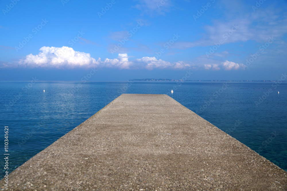 pier on the sea horizon with a thunderstorm