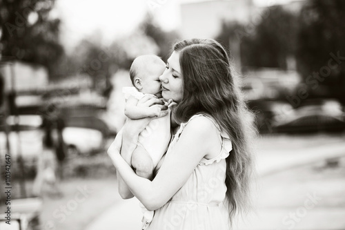 Wallpaper Mural Mom presses tight to me baby, black and white image, horizontal. Torontodigital.ca