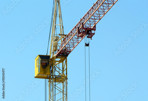 Wallpaper Mural Cranes building against the blue sky. Heavy construction equipment.  Torontodigital.ca