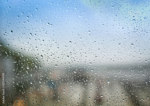 Blurry backdrop. Rainy window. View from window to cityscape. Summer autumn rain. Weather template. 