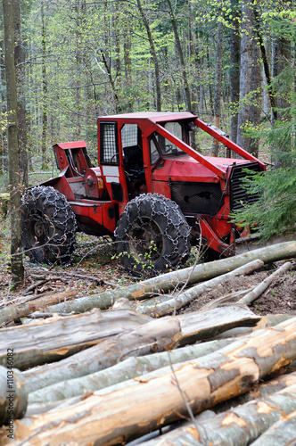 Heavy vehicle used in a logging operations for pulling cut trees out of a forest.