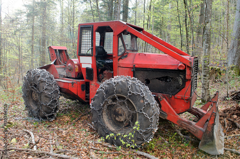 Heavy vehicle used in a logging operations for pulling cut trees out of a forest. Stock Photo