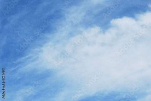 blue sky with abstract feathery clouds