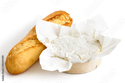 White mould cheese in wrapping with baguette isolated on white.
