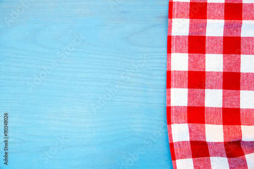 Red napkin on blue wooden table