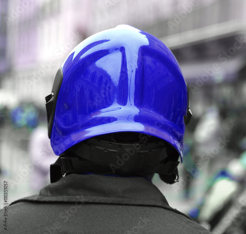 policeman with the blue protective helmet controls the people © ChiccoDodiFC