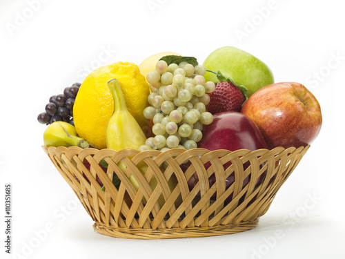 tasty summer fruits in backet isolated on white