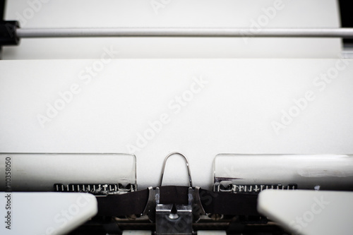 Detail view of a sheet of parchment paper in a typewriter, circa 1970.  Paper may be used as copy space.  May be used to add a message, such as Dear Dad for Father's Day.