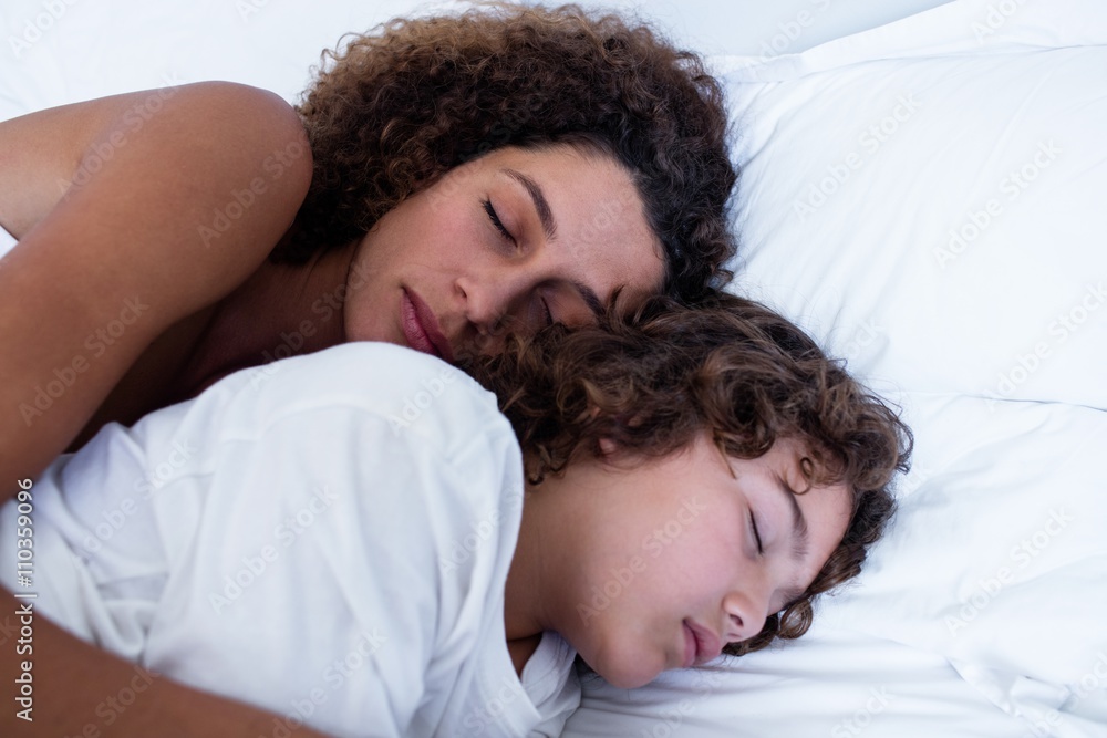 Close-up of mother and son sleeping together Stock Photo | Adobe Stock