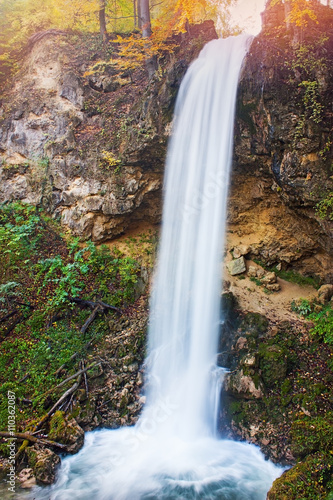 Scenic waterfall on rocky mountain side