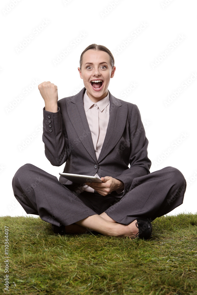 business female sittting on grass business female sittting on grass