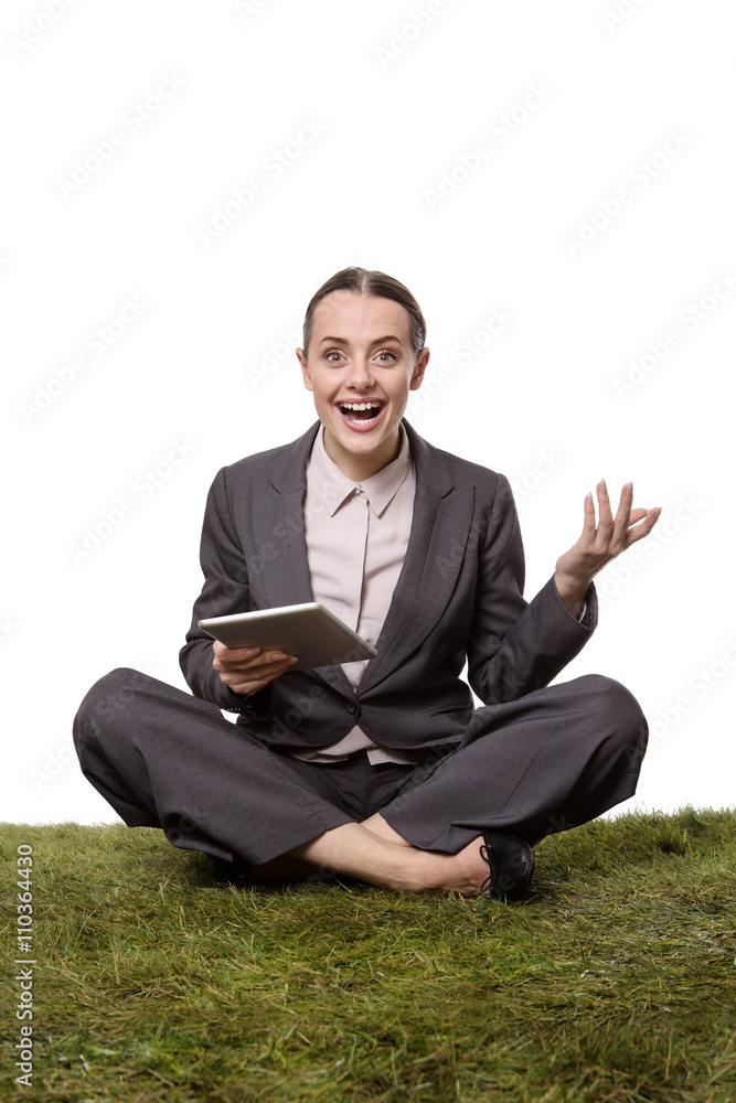 business female sittting on grass business female sittting on grass