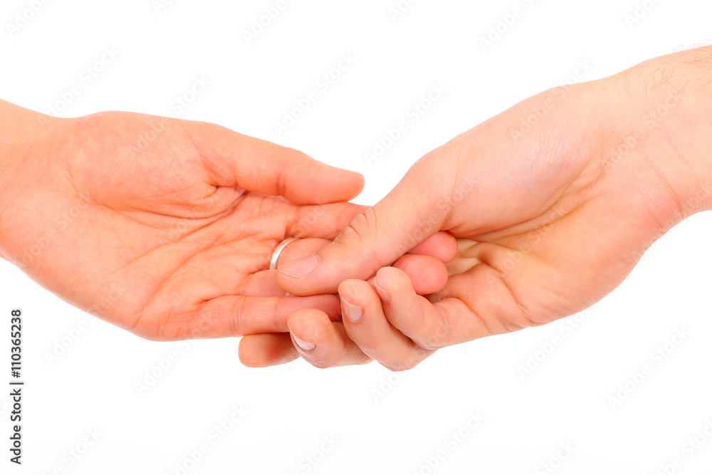 Close-up of a woman and a man holding hand in hand on a white background Close-up of a woman and a man holding hand in hand on a white background
