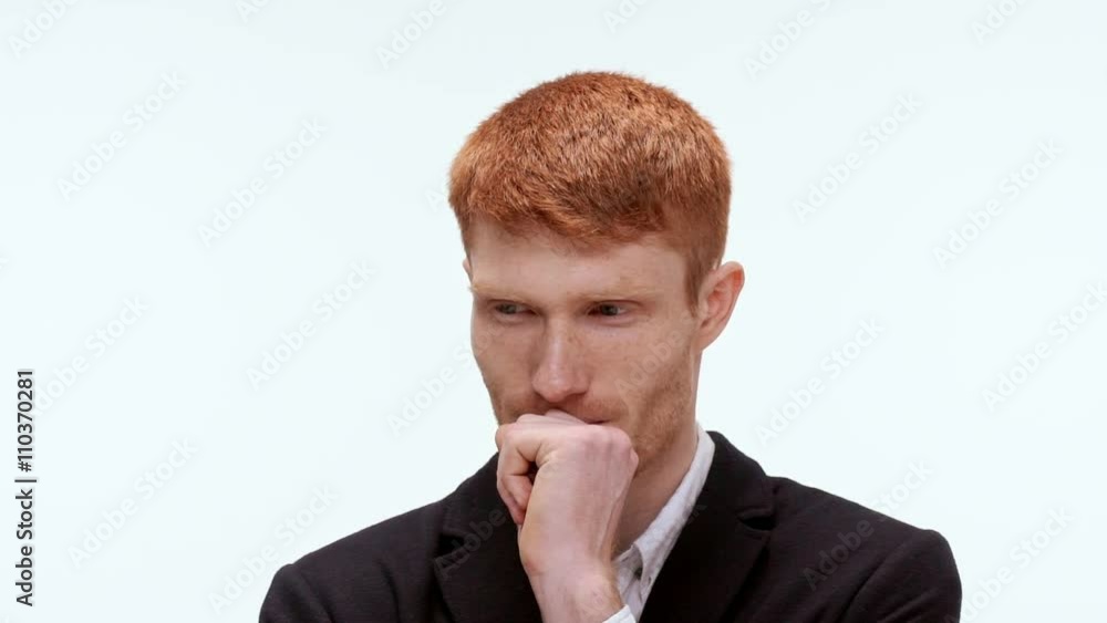 Handsome pensive redhead man reasoning . Close up. Slow motion Handsome pensive redhead man reasoning . Close up. Slow motion