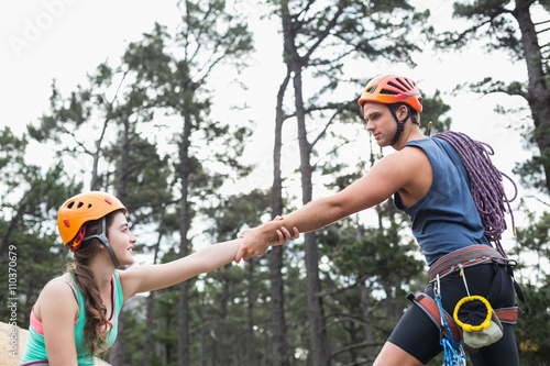 Young couple holding hands at forest