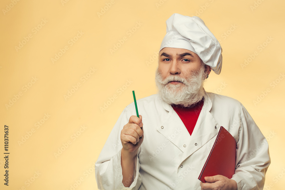 Bearded cook writing recipe Bearded cook writing recipe