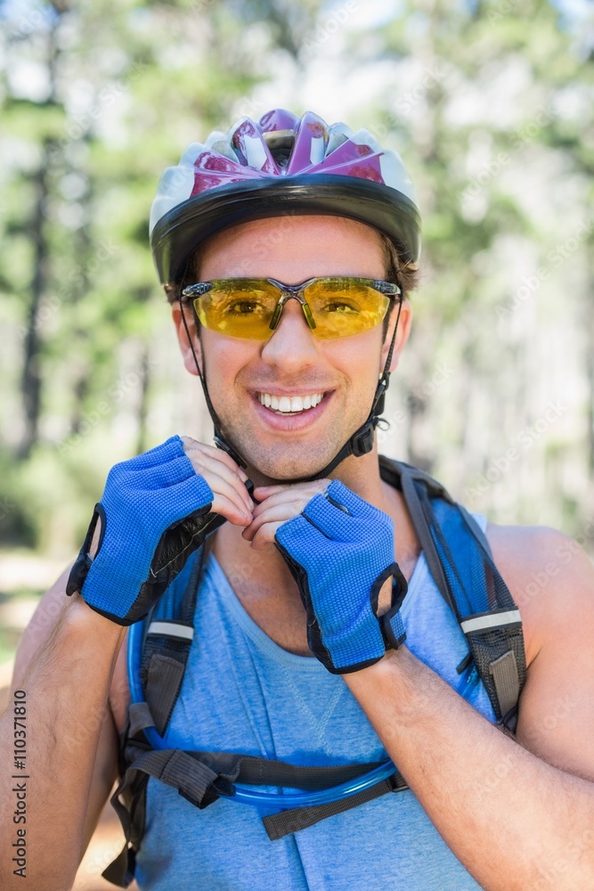 Portrait of young man wearing cycling helmet Portrait of young man wearing cycling helmet